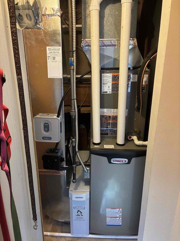 Performed scheduled heating maintenance on a Lennox gas furnace, inspecting the integrated control board, DIP switch configuration, and sensor/door-switch circuitry for proper settings and connections. Verified condition of the Honeywell control module, transformer wiring, AprilAire humidifier component, PVC condensate/vent piping, ductwork transitions, and gas and refrigerant line connections, with no visible damage, corrosion, frost, or leaks observed.