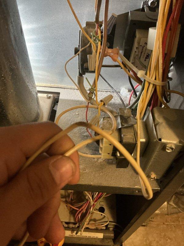 Responded to a no-heat call on a 10-year-old Amana Distinctions gas furnace and inspected the unit, including the control compartment, low-voltage wiring, transformer, and relay components, which showed heavy dust accumulation and several wire-nut splices. Performed diagnostics on the ignition and control circuit to determine the cause of the failure to start, and addressed the wiring and component conditions found to restore operation.