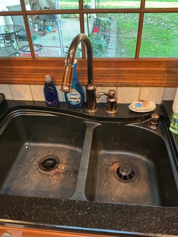 Responded to a failed water softener that ruptured during regeneration and sent sediment through the domestic water lines, leaving the kitchen sink without flow. Inspected the under-sink supply lines, shut-off valves, and drain assembly, and found corrosion at the copper riser joint and sediment staining in the basin. Flushed the affected lines and cleared the debris to restore water flow to the kitchen faucet.