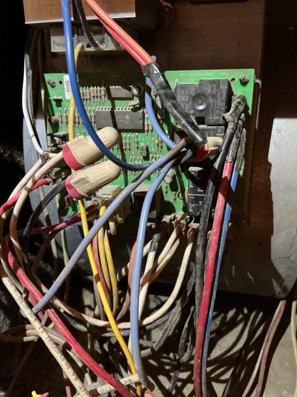 Diagnosed the 27-year-old gas furnace for a glowing component and short-cycling during heat calls, with the draft inducer assembly, control board, and surrounding wiring inspected and found dust-laden with aged, worn wiring. The glowing metal and clicking are consistent with the hot surface igniter cycling without establishing flame, and the sound heard during heat calls is consistent with the draft inducer running independently of the blower. Cleaned and inspected the affected components and verified safe operation of the ignition sequence.