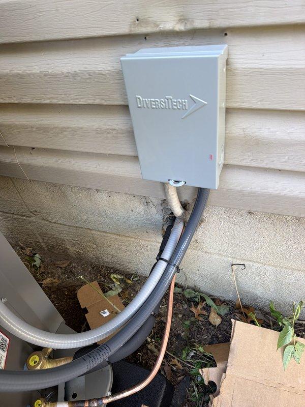 Installed a complete 90% AFUE gas furnace and matching air conditioning system, including setup of the outdoor condensing unit with a new exterior electrical disconnect and properly sized 30A Class RK5 time-delay dual-element fuses. Routed and secured flexible conduit and refrigerant lines to the outdoor unit, verified electrical connections, and confirmed the equipment showed no signs of damage or corrosion upon completion.