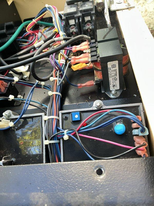 Responded to a non-operational standby generator and inspected the control compartment, including the control transformer, circuit breakers and fuse holders, relay and control boards, wiring harnesses, and the system control panel with its AUTO/OFF/MANUAL selector. No burn marks, corrosion, or broken conductors were found, and the wiring and terminations were intact, though the compartment showed significant dust and debris buildup. Cleaned the control compartment and verified connections and control circuit integrity to restore generator operation.