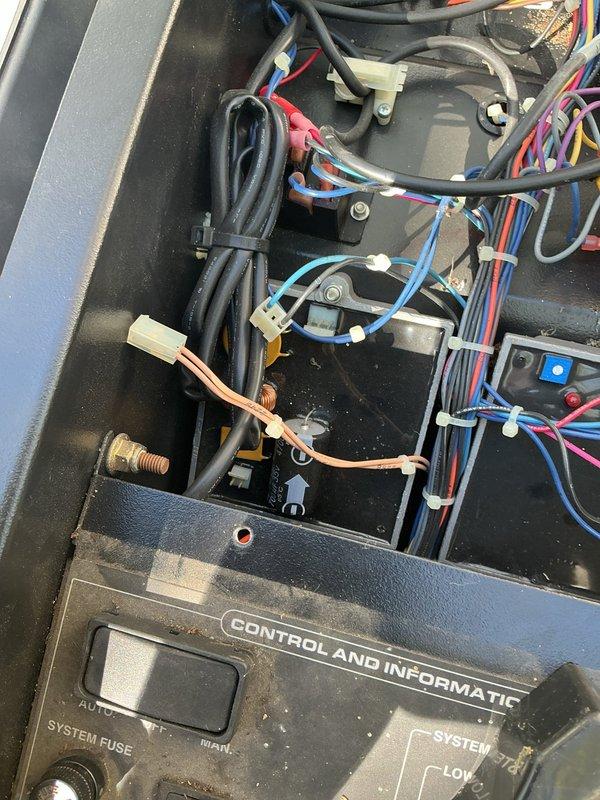 Responded to a non-operational standby generator and inspected the control compartment, including the control transformer, circuit breakers and fuse holders, relay and control boards, wiring harnesses, and the system control panel with its AUTO/OFF/MANUAL selector. No burn marks, corrosion, or broken conductors were found, and the wiring and terminations were intact, though the compartment showed significant dust and debris buildup. Cleaned the control compartment and verified connections and control circuit integrity to restore generator operation.