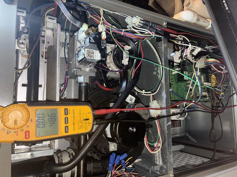 Performed a recurring heating maintenance inspection on the gas-fired furnace, including combustion analysis with a calibrated analyzer (CO 28 ppm, CO2 7.2%, stack temperature 108°F) and electrical testing of the inducer and blower motor circuits with a true RMS clamp meter. Inspected the gas valve, control board, wiring harness, and condensate/vent piping; components were dusty but showed no signs of rust, frost, or damage, and the unit is operating normally.