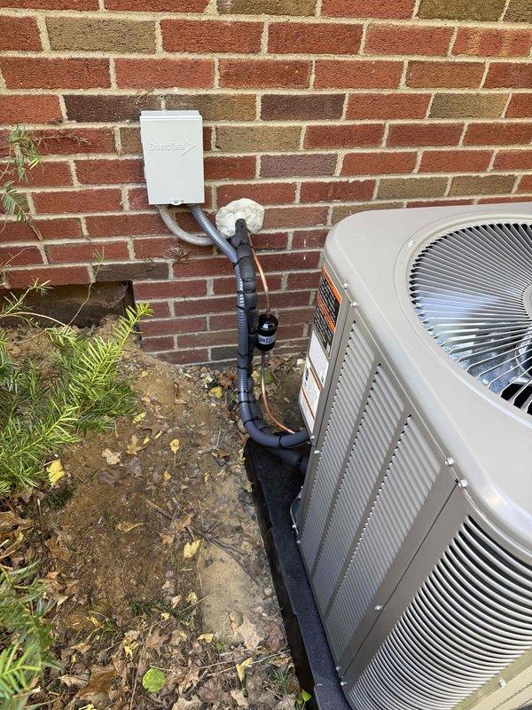 Installed a new 90% AFUE gas furnace and matching air conditioner condenser, replacing all existing ABS flue piping with code-compliant venting. Connected and insulated the refrigerant lines, installed a filter drier, and set the condenser on a level pad with a new electrical disconnect and flexible conduit. Evacuated the system to 105 microns to confirm it was dry and leak-free before startup.