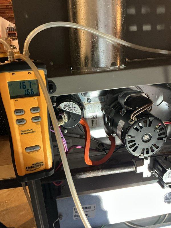 Performed a routine heating maintenance inspection on the gas furnace, including inspection of the control compartment wiring, relay, transformer, and circuit board connections for integrity and proper securement. Verified combustion airflow and draft performance by measuring inducer and pressure switch differential readings with a digital dual-port manometer, with readings of 1.67 and 1.6 in. w.c. confirming normal operation.