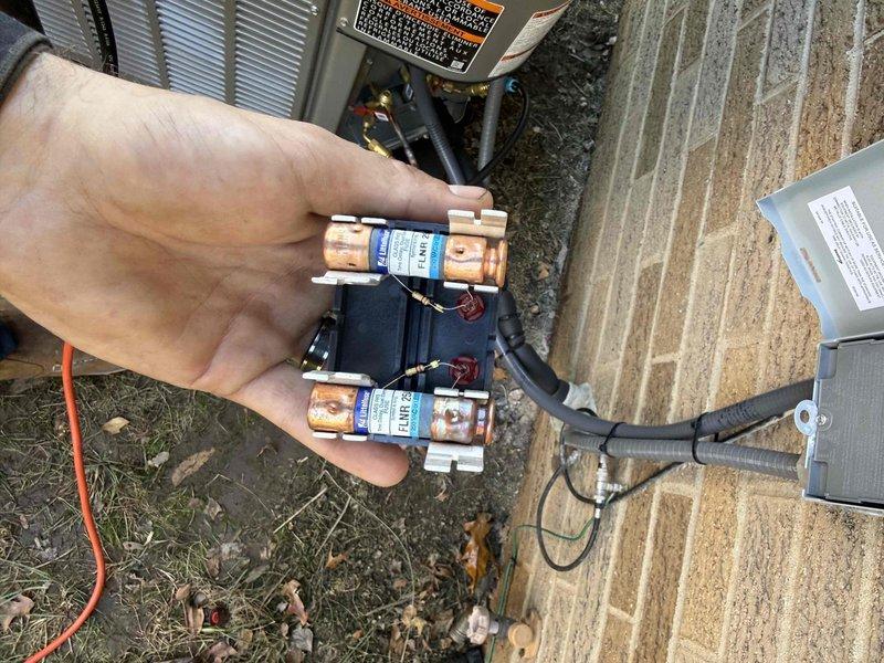 Installed a new 80% AFUE gas furnace with matching air conditioning system, including flue venting, PVC condensate drainage, and connections to the existing ductwork plenum. Wired the outdoor condenser through the electrical disconnect with new 25-amp cartridge fuses and verified the refrigerant line set and conduit connections. Completed system startup and checked for proper operation.