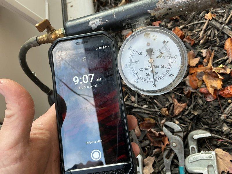Shut off the gas supply to the residence and connected a pressure gauge test assembly to the exterior gas line to facilitate pressure testing. Upon completion of the test period, returned to retrieve the gauge assembly, disconnected the test equipment, and restored gas service to the home.