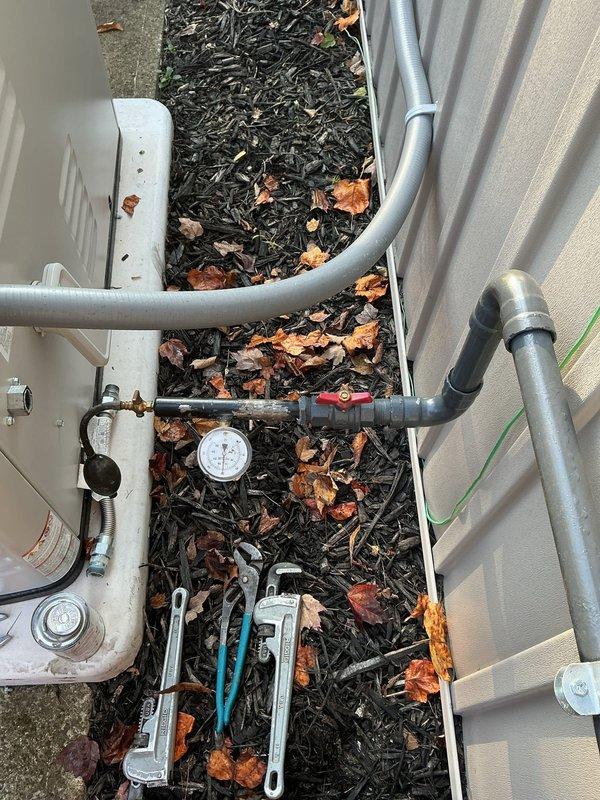 Shut off the gas supply to the residence and connected a pressure gauge test assembly to the exterior gas line to facilitate pressure testing. Upon completion of the test period, returned to retrieve the gauge assembly, disconnected the test equipment, and restored gas service to the home.