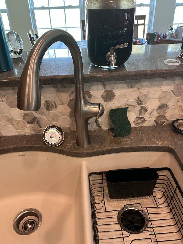 Relocated the bathroom shut-off valves to the proper position to allow for correct faucet installation, then secured the loose kitchen faucet by tightening its mounting hardware to the countertop, restoring a stable, leak-free connection. Verified proper operation of both fixtures.