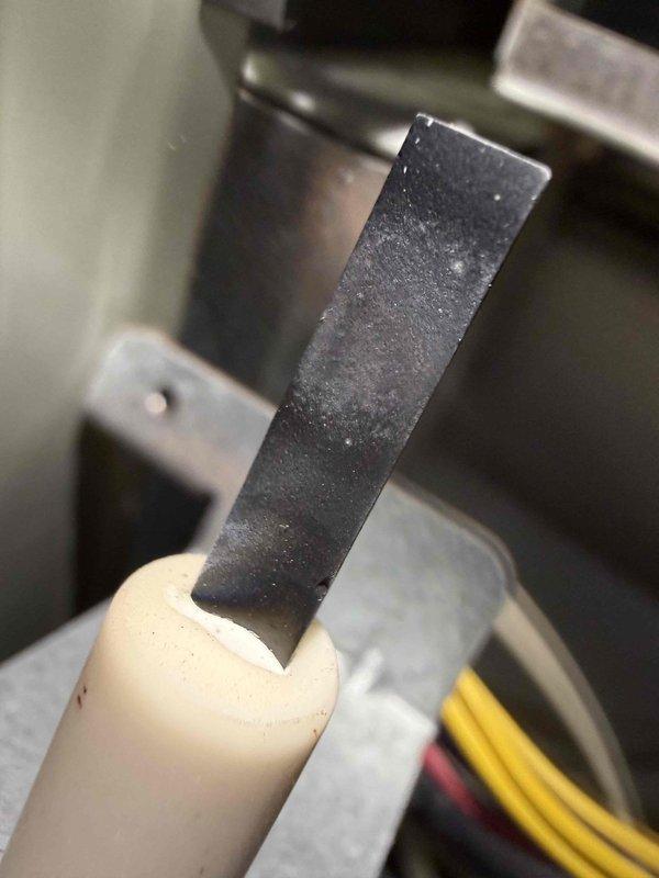 Performed scheduled heating maintenance, including a camera inspection of the heat exchanger and a full inspection of the ignition system. Found the flame sensor rod coated with oxidation and residue, which can cause flame rectification faults and intermittent burner lockouts. Recommend cleaning or replacing the sensor to restore reliable flame sensing and proper furnace operation.