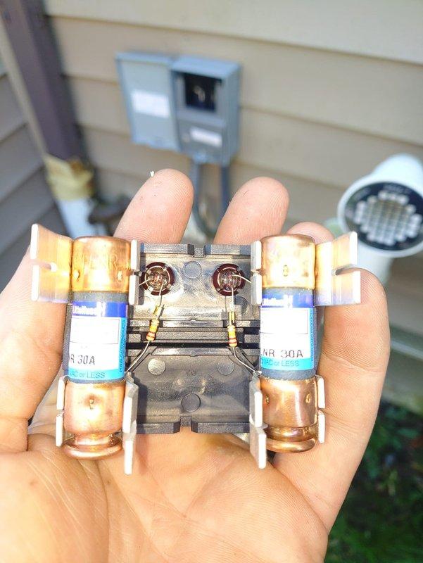 Installed a complete split HVAC system consisting of a 90% AFUE gas furnace and a Lennox air conditioning condenser, set on a composite pad with insulated refrigerant line set connected to the service valves. Installed a pullout-style fused disconnect with 30A cartridge fuses at the exterior electrical disconnect box to provide proper overcurrent protection and service isolation for the condensing unit.