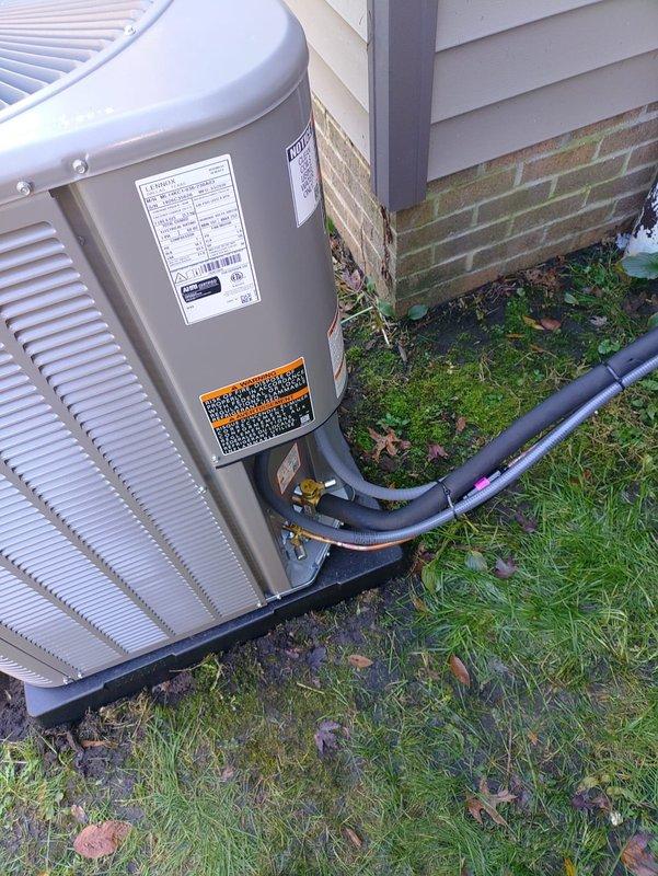 Installed a complete split HVAC system consisting of a 90% AFUE gas furnace and a Lennox air conditioning condenser, set on a composite pad with insulated refrigerant line set connected to the service valves. Installed a pullout-style fused disconnect with 30A cartridge fuses at the exterior electrical disconnect box to provide proper overcurrent protection and service isolation for the condensing unit.