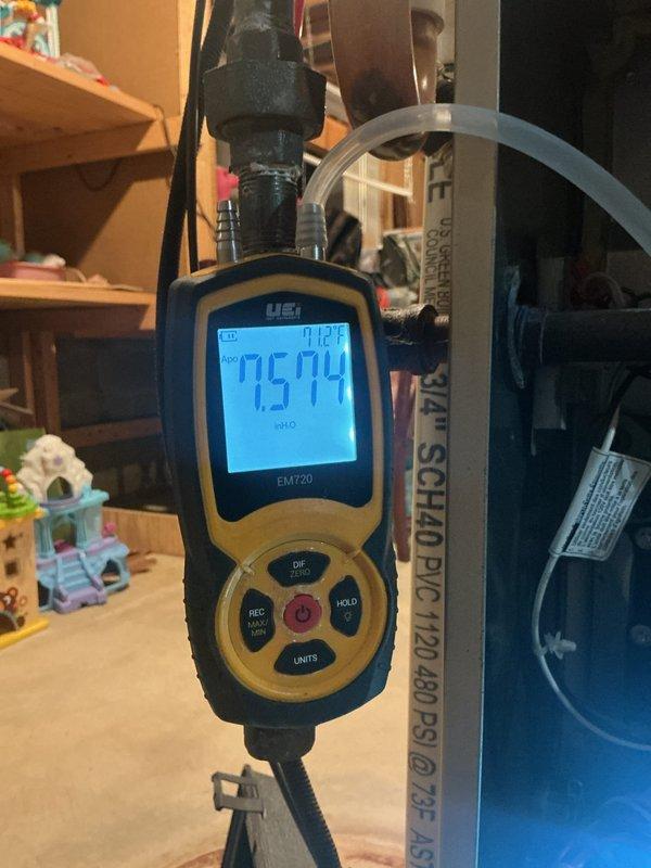Performed scheduled heating maintenance, including electrical testing of the ignition circuit with a digital clamp meter and inspection of the igniter and terminal hardware. Measured gas manifold pressure with a digital manometer (reading approximately 7.5 in. w.c.) to verify proper burner operation, and checked the PVC condensate and vent piping connections.