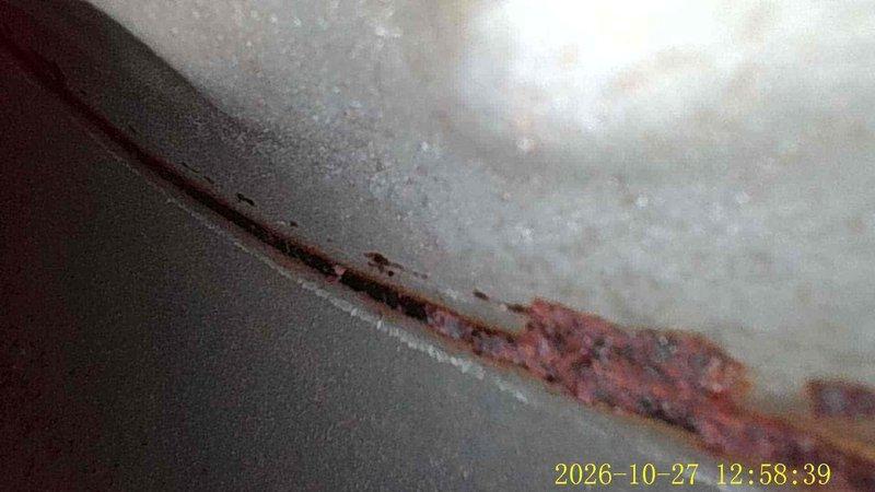 Responded to a water leak at a 7-year-old gas furnace and performed a diagnostic inspection using a borescope. The inspection revealed corrosion along the heat exchanger and flue-side seams, with rust scaling and deterioration at the joints, along with corrugated flexible venting showing early rust spotting. These conditions are consistent with condensation leakage, and further evaluation of the heat exchanger and venting components is recommended to determine the source of the moisture and prevent further degradation.