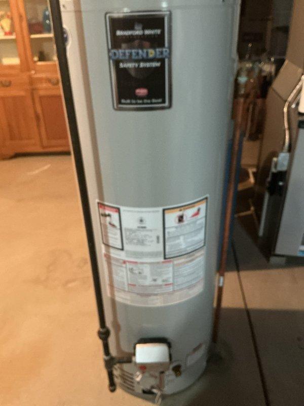 Provided an estimate for replacement of the existing gas-fired tank-style water heater, inspecting the unit, its galvanized flue venting, gas supply with shutoff valve, copper supply piping, and existing expansion tank. The heater and associated components showed no visible signs of leaks, corrosion, or frost damage, and the installation was documented photographically to support the replacement quote.