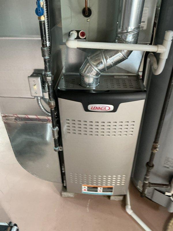 Performed annual maintenance tune-up on a Lennox gas furnace less than one year old, inspecting the control compartment, integrated control board, wiring connections, and splices for secure terminations. Verified the flue piping, gas line and shutoff valve, condensate/PVC drain piping, and electrical disconnect were properly installed with no visible leaks, corrosion, or damage. Unit is in good condition and operating normally.