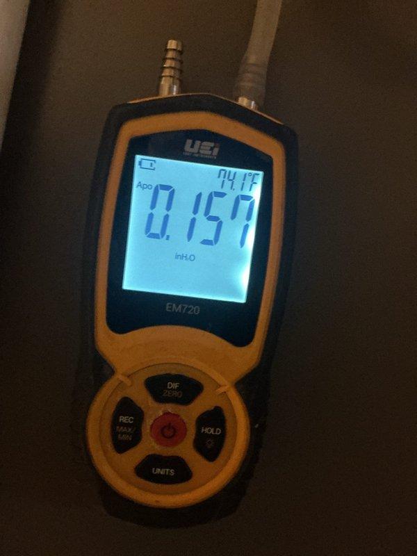 Performed furnace maintenance and verified system operation using a UEi EM720 digital manometer to measure pressure readings, including inlet gas pressure at the gas valve (approximately 7.2 inH2O) and a secondary differential pressure reading of 0.157 inH2O. Inspected the burner compartment, wiring harnesses, and inducer assembly, and confirmed all measurements were within normal operating parameters for safe and efficient heating performance.