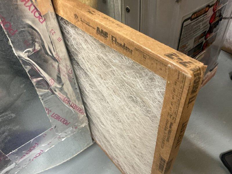 Performed annual furnace maintenance, including inspection and replacement of the fiberglass return air filter, which showed dust loading and discoloration. Accessed and inspected the blower assembly, noting a light accumulation of dust and debris on the squirrel-cage wheel blades and housing, and verified the wheel was secure on its shaft. System was left clean and operational with improved airflow.