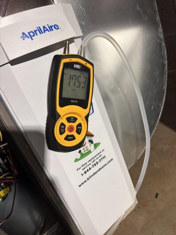 Installed a new 80% AFUE gas furnace with a galvanized flue connected to the existing masonry chimney, and reconnected the gas supply through a shutoff valve and the condensate/drain piping. Installed an AprilAire media air filter cabinet, verified static pressure across the filter with a digital manometer, and sealed the sheet metal duct seams with foil tape. Also installed a whole-home surge protector.
