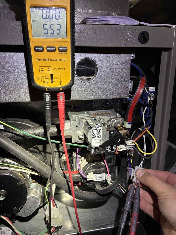Performed a routine heating system maintenance inspection, including electrical diagnostics on the gas valve and associated wiring using a True RMS clamp meter to verify proper voltage and circuit continuity. Inspected the control board, relays, wiring harnesses, and blower assembly, confirming secure connections and proper wire routing with no visible corrosion, rust, or component damage.