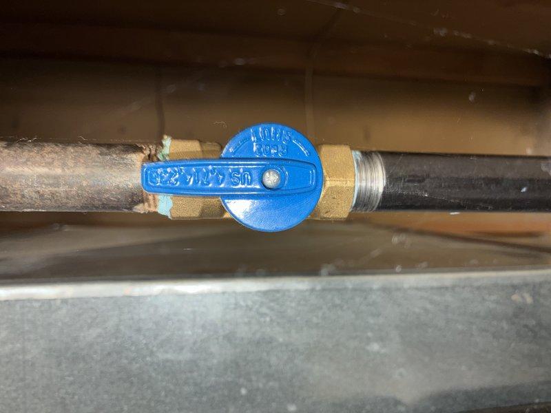 Performed a furnace tune-up, including inspection of the gas supply line and verification of the manual gas shutoff valve for proper operation. Noted corrosion (verdigris) at the copper-to-brass fitting junction on the gas line and recommend monitoring the connection for leaks or further deterioration. Cleaned and inspected components, including use of a cleaning rod for the burner/flue passages, and confirmed the system is operating safely.