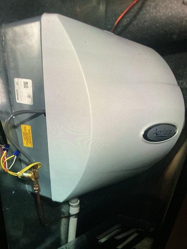 Performed annual MVP furnace maintenance, including inspection of the Aprilaire whole-home humidifier. Evaluated the evaporator pad, which showed discoloration consistent with mineral buildup, and verified the water supply fitting, drain line, and electrical connections were secure with no signs of leaks, rust, or damage. Unit is operating normally.
