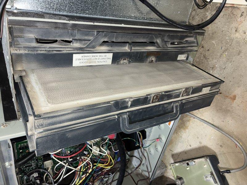 Performed scheduled heating maintenance on a 16-year-old furnace, including inspection of the air handler cabinet, control board wiring, and filter assembly. Removed and serviced the heavily dust-laden filter, and inspected the condensate pump and drain line connections for proper operation.