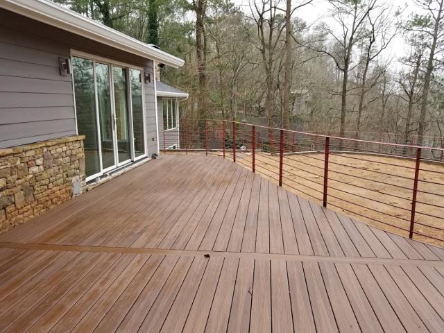 Atlanta, GA - Reviewing this newly built deck and railing at an Atlanta renovation. The railing will be painted black this week. This is the last part of a very large remodel which included Siding and Trim Replacement, Stone, Back Yard Leveling (removing a pool), Painting, and Gutters. Atlanta, GA - Reviewing this newly built deck and railing at an Atlanta renovation. The railing will be painted black this week. This is the last part of a very large remodel which included Siding and Trim Replacement, Stone, Back Yard Leveling (removing a pool), Painting, and Gutters.