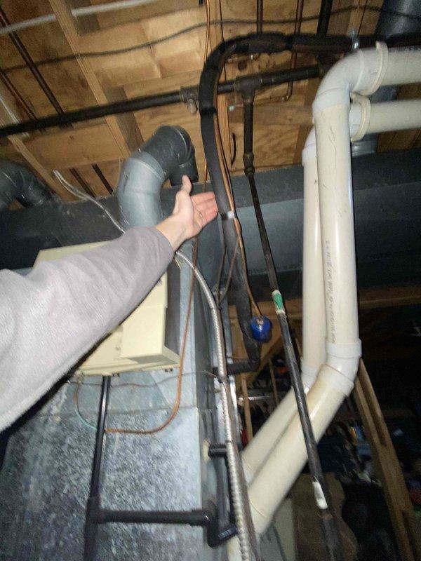Performed assessment of propane HVAC system following lead from Jeff. Inspection revealed aging unit with exposed internal components and wiring requiring replacement. Examined existing ventilation infrastructure including PVC pipes and ductwork connections. Evaluated plumbing integration with current system to determine appropriate specifications for replacement unit.