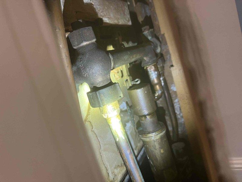 Inspected property for multiple reported leaks including water supply line, tub spout in two bathrooms, sink sprayer in basement, and corroded standpipe in laundry room. Diagnosed pressure issues in shower and occasional floor drain backup in laundry room. Identified faulty gas valve by washer/dryer requiring replacement and assessed suitability for automatic water shutoff system installation.