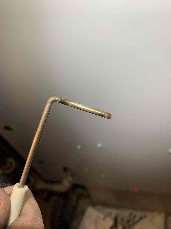 Performed routine 2-year heating maintenance on member's system. Discovered significant ice buildup on evaporator coil indicating possible refrigerant restriction or airflow issues. Used hex key tool to access components for proper inspection and servicing.
