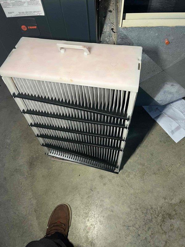 Performed installation of Aprilaire filter upgrade kit as previously sold. Removed existing filter and installed new multi-pleated filtration system with diamond-patterned mesh structure in customer's Trane unit. Successfully completed the upgrade per service agreement, with all necessary materials sourced from inventory.