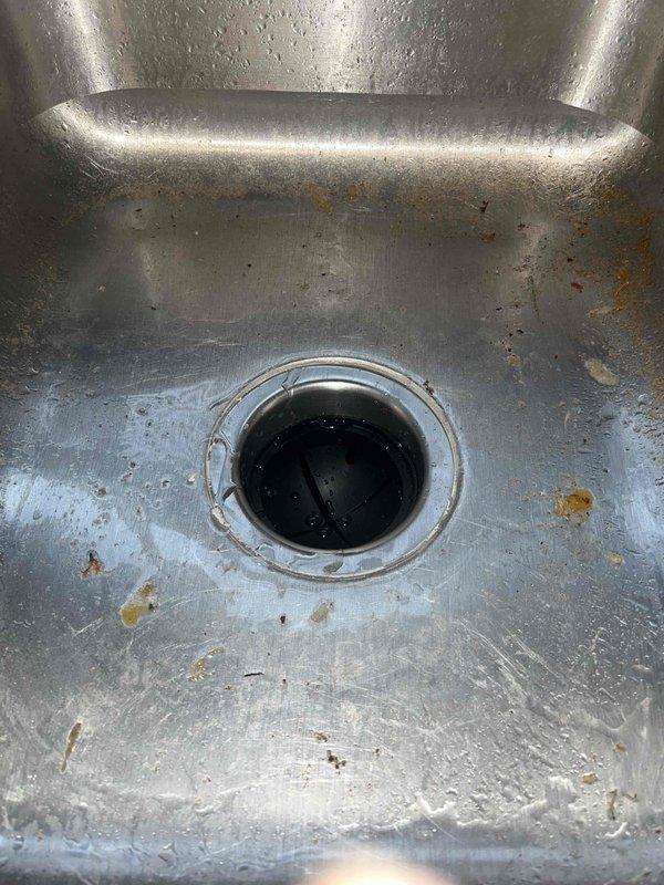 Responded to call for blocked garbage disposal issue. Upon arrival, inspected the Badger unit installed under kitchen sink. Cleared obstruction and tested drainage by running water through stainless steel sink basin. Unit now functioning properly with normal water flow.