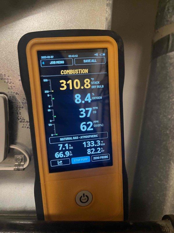Performed comprehensive tune-up on furnace air handler including combustion analysis testing with readings of 310.8°F stack temperature, 8.4% O2, and 37/62 PPM CO levels. Electrical system inspection conducted using clamp meter verified 6.32V at terminals, ensuring proper voltage supply to components. System operating at 66.9% efficiency with 82.2°F temperature differential.