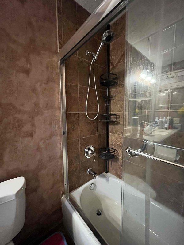 Returned to complete the previously sold water heater installation and shower repair. Installed new Coline water heater with expansion tank and all necessary copper supply lines and valves per code. Confirmed proper function of the bathtub-shower combination unit, including handheld showerhead mount, water controls, and drainage system.