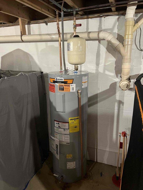 Returned to complete the previously sold water heater installation and shower repair. Installed new Coline water heater with expansion tank and all necessary copper supply lines and valves per code. Confirmed proper function of the bathtub-shower combination unit, including handheld showerhead mount, water controls, and drainage system.
