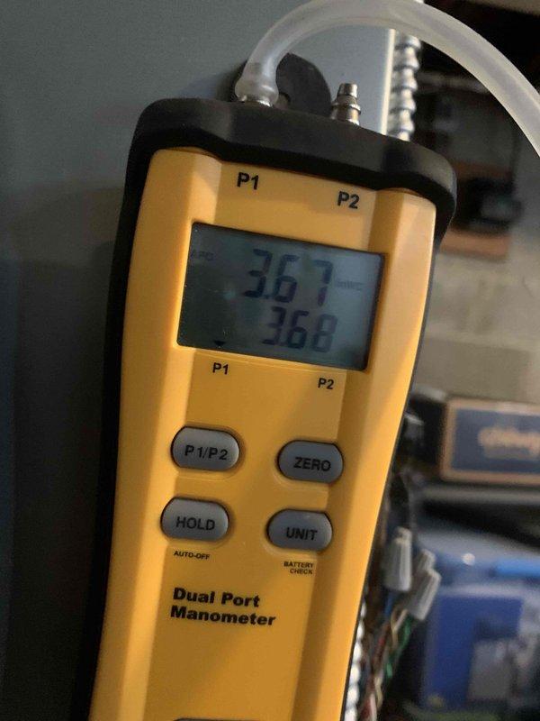 Responded to customer report of furnace turning on without producing heat before cycling off. Diagnostic testing with dual port manometer confirmed gas pressure readings of 36.7/36.8, indicating proper gas supply. Identified and resolved issue with faulty limit switch causing premature cycling. System now operating correctly with proper heat distribution.