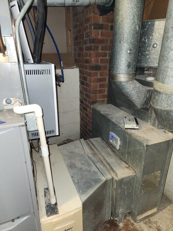 Successfully completed installation of two steam humidifiers as part of sold repair, coordinating with electrician Jackie who handled electrical connections. Both units were properly installed in the basement mechanical room alongside existing HVAC equipment including furnace, air handler and ductwork.