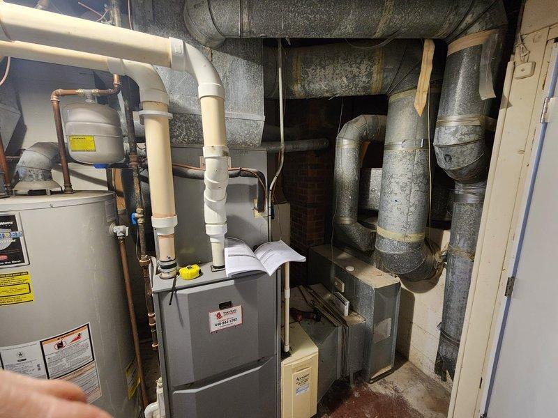 Successfully completed installation of two steam humidifiers as part of sold repair, coordinating with electrician Jackie who handled electrical connections. Both units were properly installed in the basement mechanical room alongside existing HVAC equipment including furnace, air handler and ductwork.