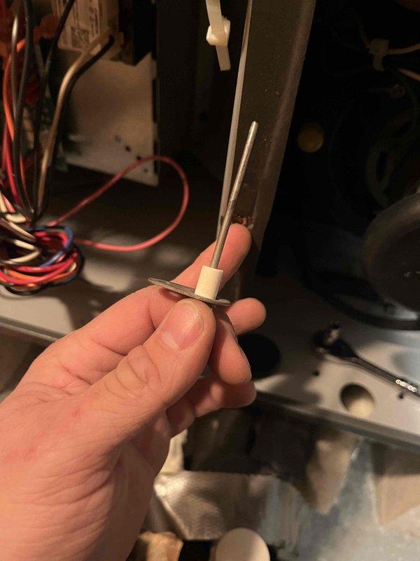 Responded to no-heat call on 5-year-old furnace that was set to 75°F but reading 71°F and dropping. Inspection revealed faulty flame sensor causing intermittent operation. Removed, cleaned, and reinstalled flame sensor, then tested system functionality through complete heating cycle. Unit is now operating properly with consistent flame recognition.