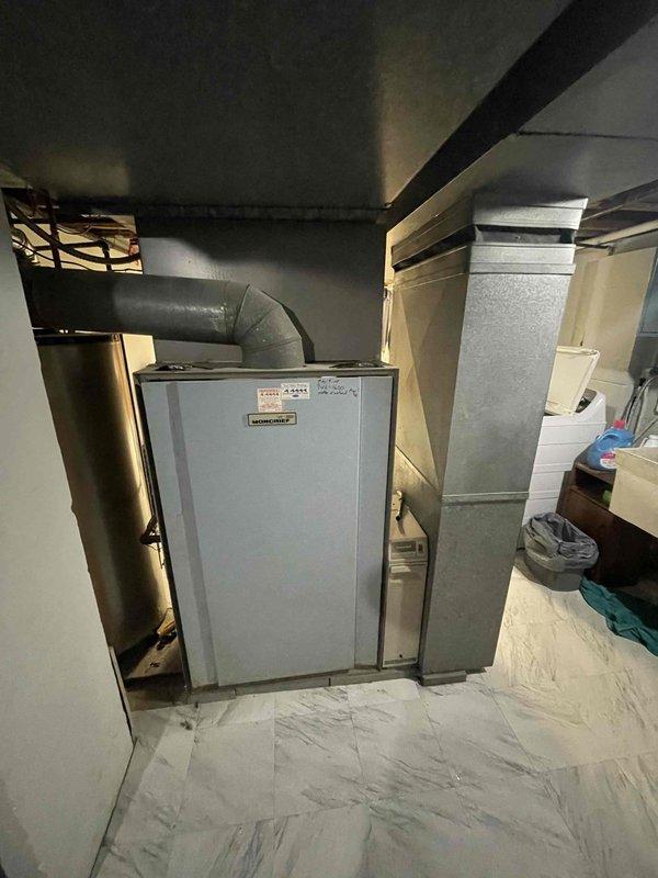 Installed and wired customer-supplied humidistat to existing Heatcoil furnace system with side-mounted humidifier unit. Completed all necessary electrical connections using flexible metal conduit, ensuring proper integration with the HVAC control system for optimal humidity regulation.