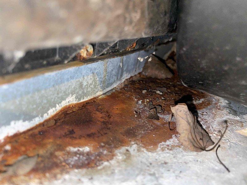 Responded to no heat complaint for aging Distinction furnace. Inspection revealed extensive corrosion and rust on heat exchanger, indicating critical safety hazard. Condemned unit due to cracked heat exchanger which was allowing combustion gases to mix with supply air. Recommended complete system replacement as repair not economically viable for equipment of this age.