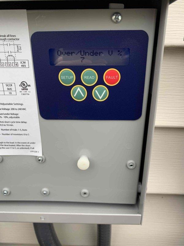 Returned to complete installation of two voltage monitoring surge protectors as previously sold. Monitored system voltage (reading 237.4V) and installed protective equipment with proper settings for the customer's electrical parameters (200-240 VAC range). Successfully configured over/under voltage protection settings to prevent equipment damage from power fluctuations.