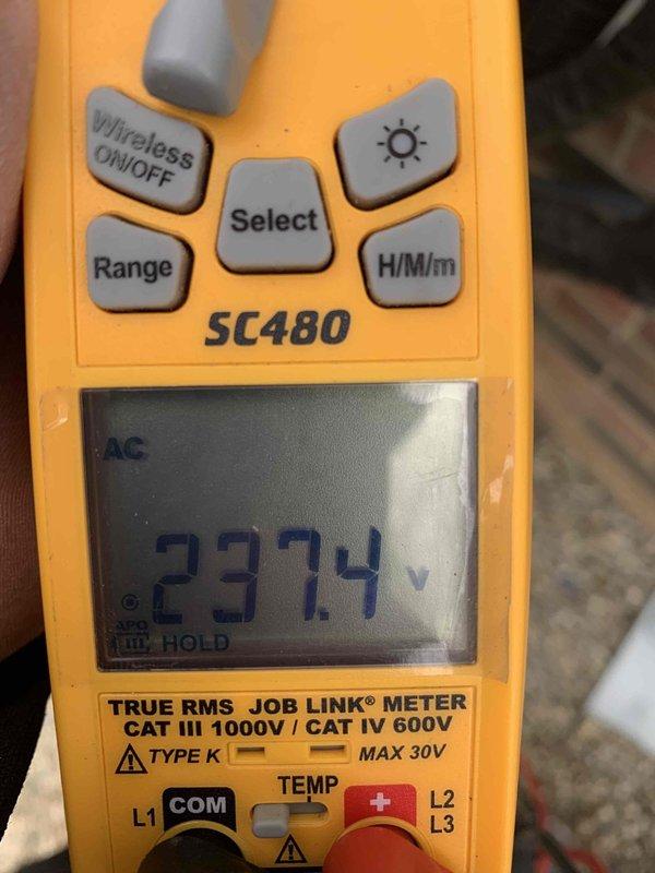 Returned to complete installation of two voltage monitoring surge protectors as previously sold. Monitored system voltage (reading 237.4V) and installed protective equipment with proper settings for the customer's electrical parameters (200-240 VAC range). Successfully configured over/under voltage protection settings to prevent equipment damage from power fluctuations.