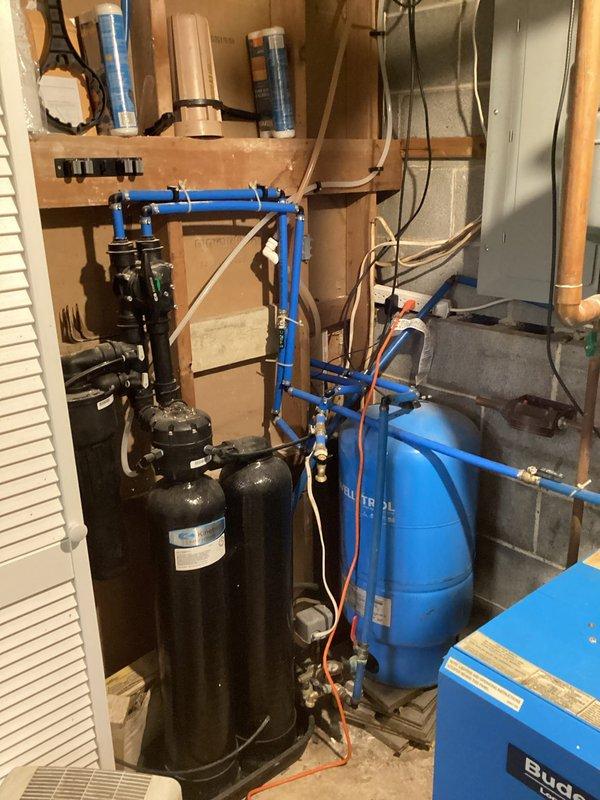 Successfully performed lead sequence modification on hydronic boiler system, switching primary boiler designation from Bruno unit to AZ unit. Visual inspection of basement mechanical room confirmed proper operation of associated water treatment components including filtration tanks and pressure vessel.