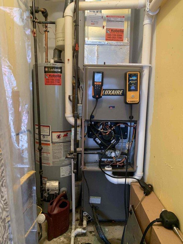 Completed installation of code-compliant gas piping for furnace as per previous sale agreement. Performed combustion analysis using Testo 310 analyzer, confirming proper oxygen levels at 5.9% for the Luxaire furnace system. Verified all connections and operational status of both the furnace and adjacent Lochinvar water heater to ensure safe and efficient operation following the upgrade.