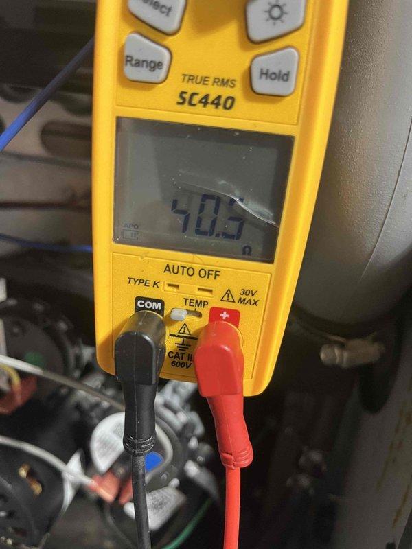 Performed heating maintenance on member's air handler unit. Inspected and replaced dirty air filter. Conducted electrical testing with multimeter, confirming resistance reading of 40.5 ohms on system components to verify proper operation.