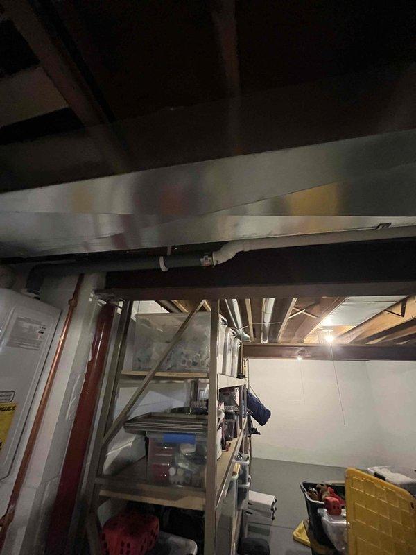 Conducted an on-site assessment for adding a new supply duct run to the homeowner's mother's room. Evaluated the existing ductwork system in the utility area where exposed ceiling infrastructure and joist spaces provide access for the new installation. Identified optimal route for the additional ductwork that will connect to the current HVAC distribution system.
