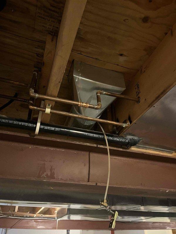 Conducted an on-site assessment for adding a new supply duct run to the homeowner's mother's room. Evaluated the existing ductwork system in the utility area where exposed ceiling infrastructure and joist spaces provide access for the new installation. Identified optimal route for the additional ductwork that will connect to the current HVAC distribution system.